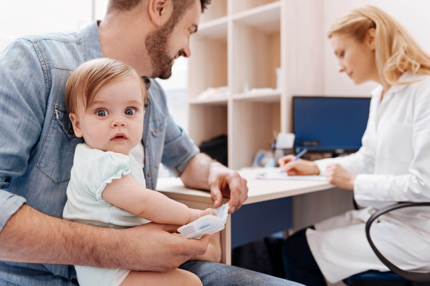 baby with doctor for color blindness