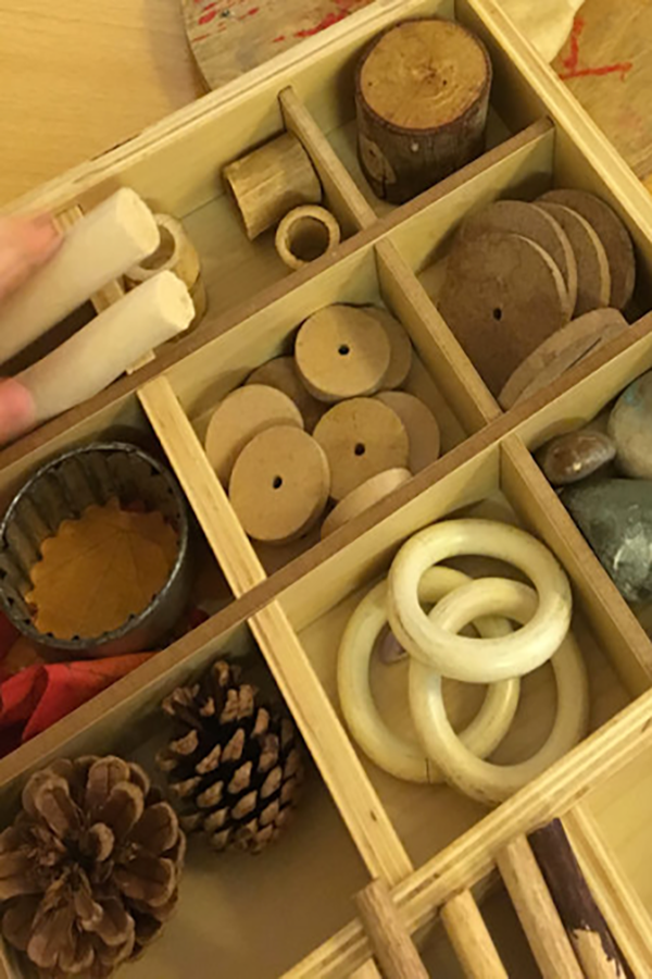 Tinker trays allow children to engage in positioning schema play