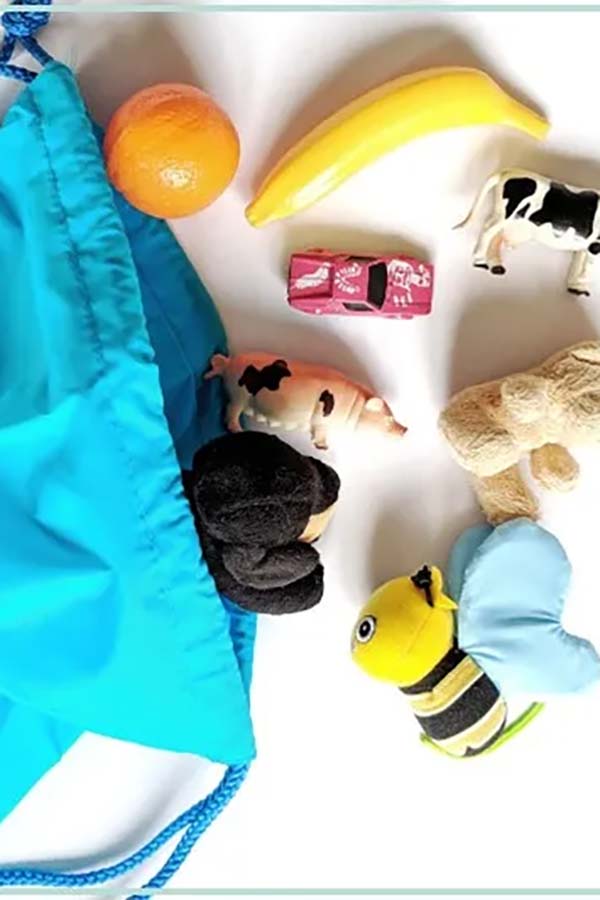 Hiding toys in a bag can engage the enveloping play schema