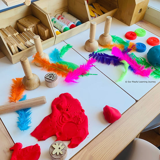 Playdough set up with stampers and feathers