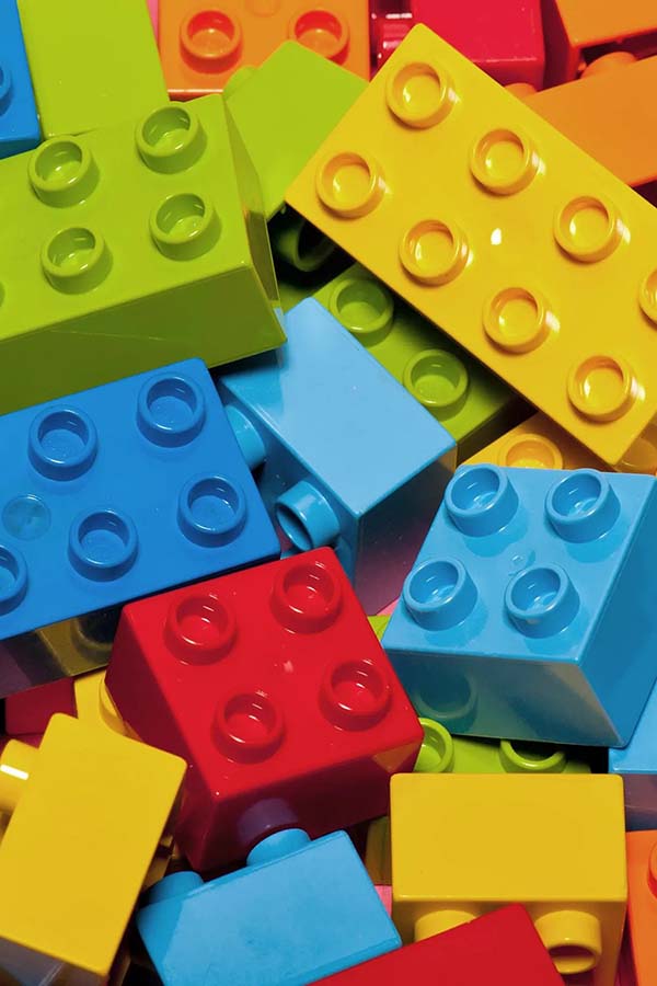 A pile of LEGO blocks is a classic toy for the connecting play schema