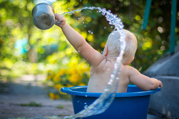 child playing with water