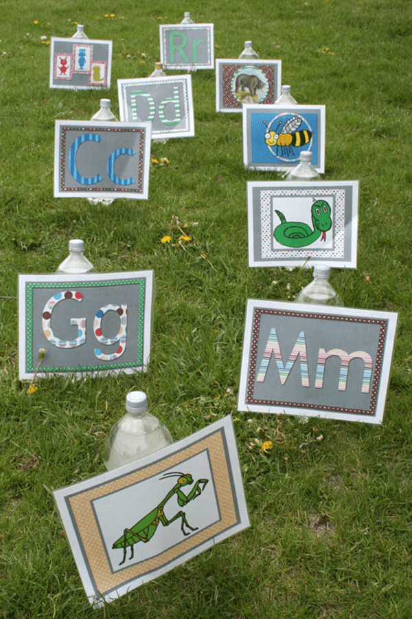Alphabet signs stuck in a grassy lawn