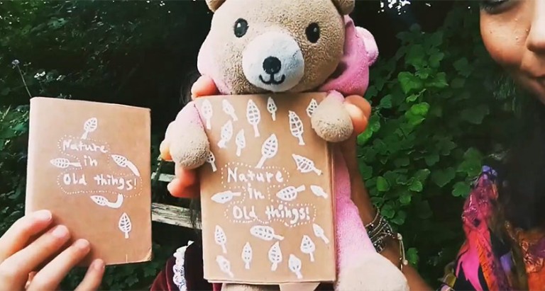 a teddy bear with two homemade nature journals