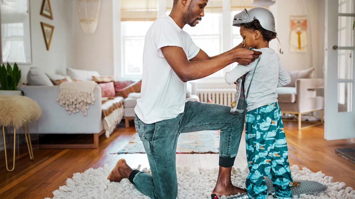 man and child engaging in pretend play